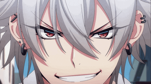a close up of a person 's face with a smirk on their face