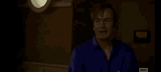a man in a blue robe is holding a can of soda and saying `` well , i guess , uh . ''