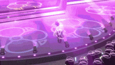 a person is standing on a stage with a purple background