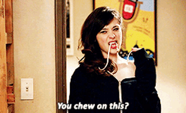 a woman with a toothpick in her mouth is asking if she chew on this