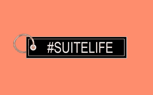 a keychain with the words #suitelife written on it