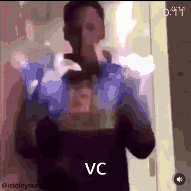 a blurred image of a person with the words vc on the bottom