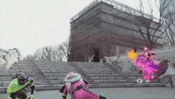 a person in a pink and green outfit is standing in front of stairs