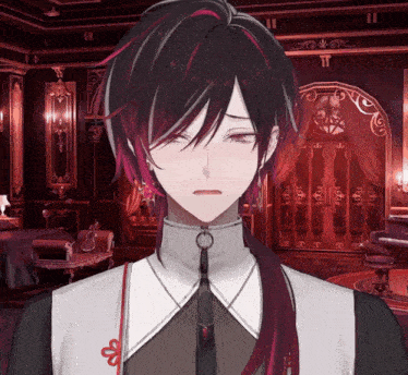 a man with long black hair and red highlights is standing in a dark room