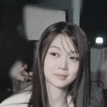 a close up of a woman 's face with long hair