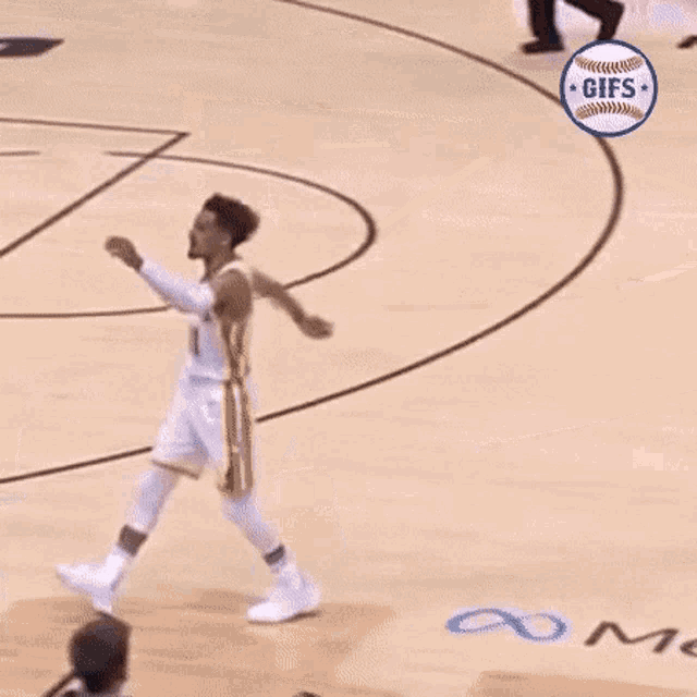 a basketball player with the number 11 on his jersey is standing on the court .