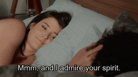 a woman laying on a bed with the words mmmm and i admire your spirit above her