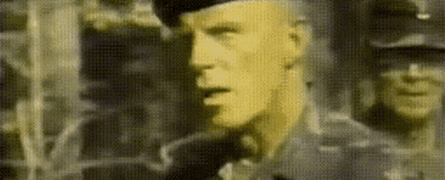 a close up of a man 's face with a blurred background