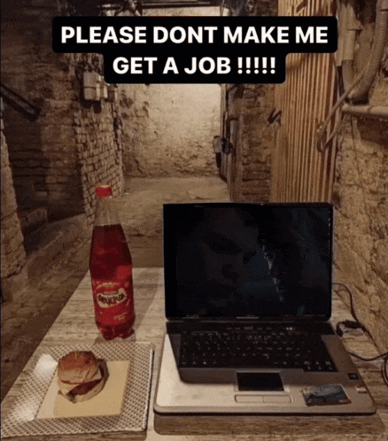a bottle of minute maid sits next to a laptop on a table