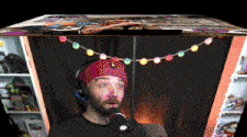 a man wearing headphones is talking into a microphone