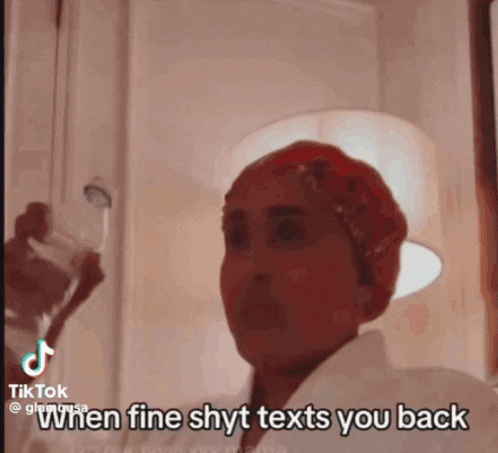 a woman holding a glass of water with the caption when fine shyt texts you back