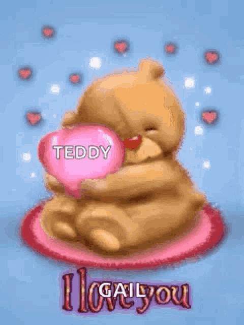 a teddy bear is holding a pink heart with the words `` teddy i love you '' on it .