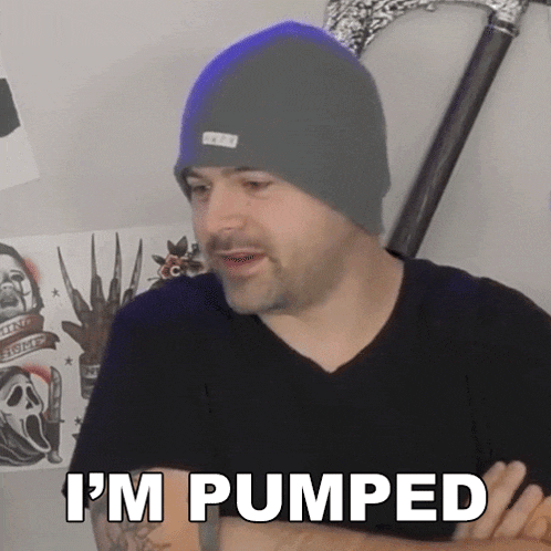 a man wearing a gray beanie says i 'm pumped