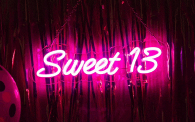 a neon sign that says sweet 13 on it
