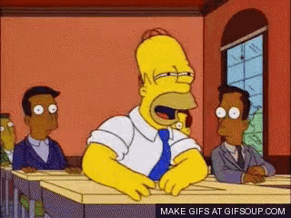 a cartoon of homer simpson sitting at a desk with his mouth wide open