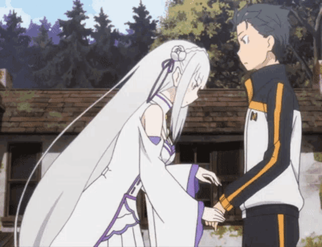 a boy and a girl are standing next to each other and the girl is wearing a white dress