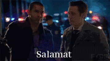 two men are standing next to each other and the word salamat is on the bottom