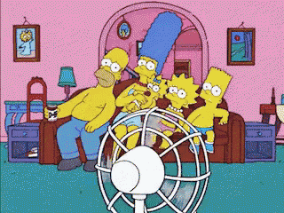 a cartoon of the simpsons sitting around a fan in a living room