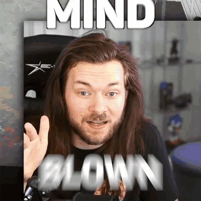 a man with long hair and a beard has the words mind blown written above him