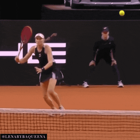 a tennis player is about to hit a tennis ball with a logo for lenarybaqueena in the corner