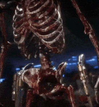 a skeleton in a cowboy hat is holding a gun in his hand .