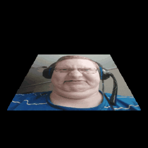 a man wearing glasses and headphones is making a face