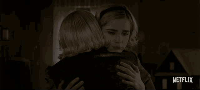 two girls hugging each other with a netflix logo in the corner
