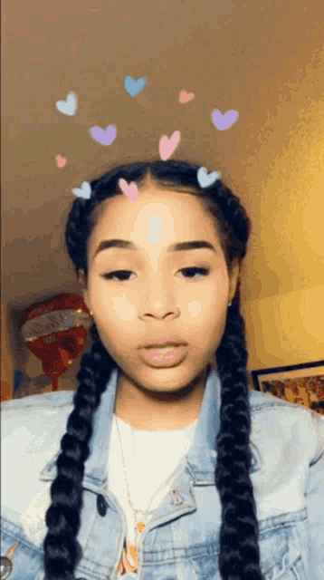 a girl with braids and hearts in her hair