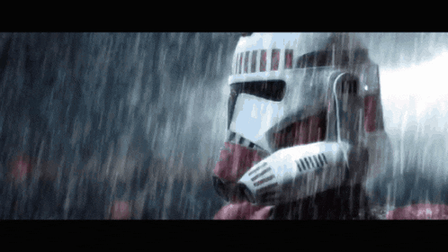 a storm trooper is standing in the rain wearing a helmet