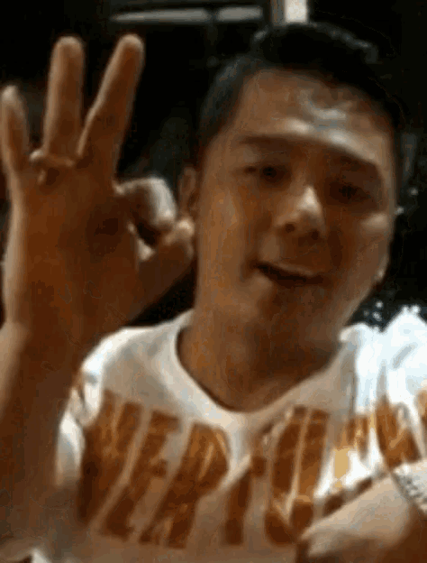 a man wearing a t-shirt that says vertigo on it
