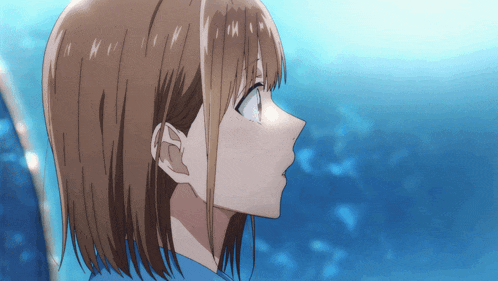 a close up of a girl 's face with a blue sky in the background