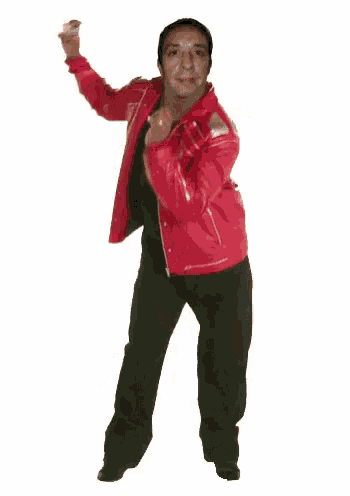a man in a red leather jacket and black pants is dancing .