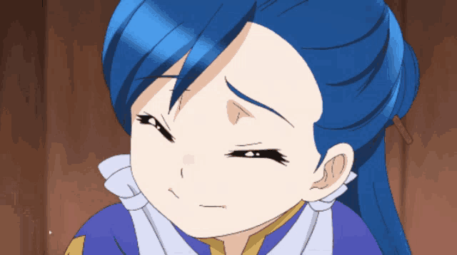 a close up of a blue haired anime girl with a sad look on her face