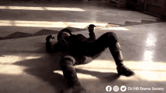 a man is laying on the floor with the words ch7hd drama society written on the bottom