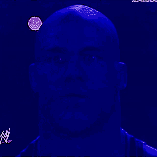 a close up of a man 's face with the letters n on the bottom right