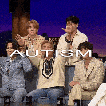 a group of people are sitting on a couch with the word autism written on the screen