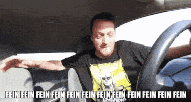 a man is driving a car with the words fein fein fein fein fein fein fein fein fein