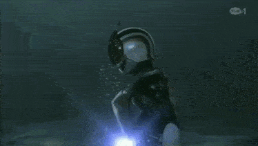 a scuba diver with a clock on his belt is underwater
