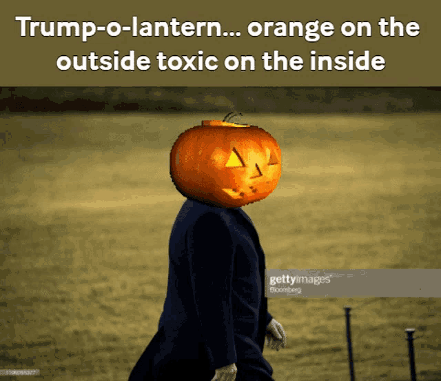 a man with a pumpkin on his head that says trump-o-lantern on it