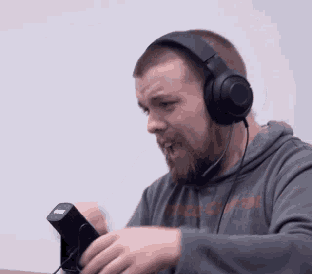 a man wearing headphones and a shirt that says ' abercrombie & fitch '