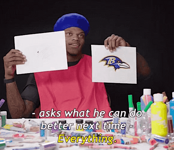 a man is holding up a picture of the ravens and says " asks what he can do better next time "