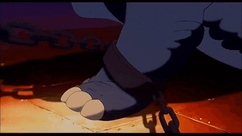 a cartoon elephant 's feet are chained together