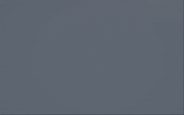 a dark blue background with a few clouds in the sky