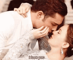 a man kissing a woman on the forehead with the words i love you below them