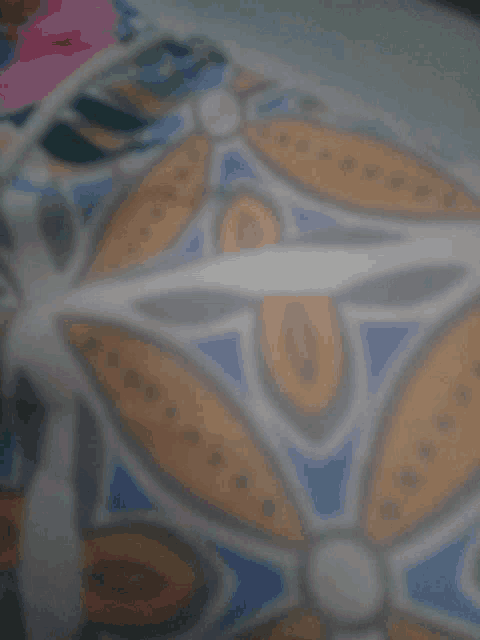 a blurred image of a floral pattern with the number 10 in the middle