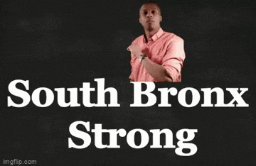 a man in a pink shirt is standing in front of a blackboard that says south bronx strong