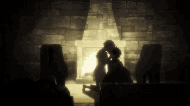 a couple is kissing in front of a fireplace