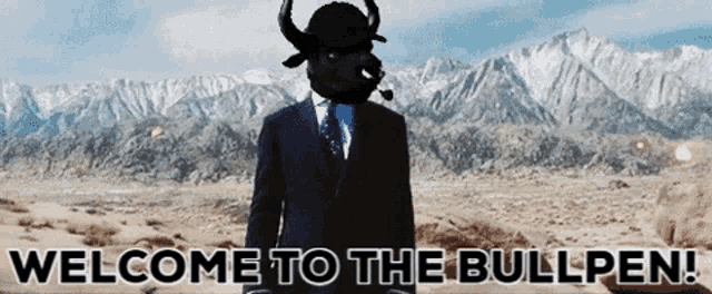 a man in a suit has a bull mask on his head and the words welcome to the bullpen below him