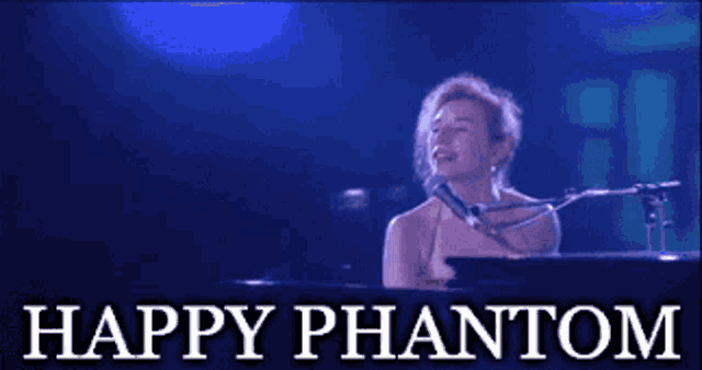 a woman singing into a microphone while playing a piano with the words happy phantom above her