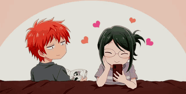 a boy with red hair and a girl with green hair are laying on a bed